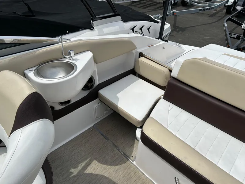 Slide: The Image of 2016 Regal 2250 Cuddy boat interior with seating and sink. - 24