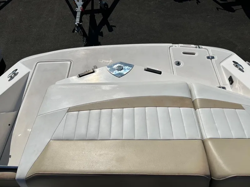 Slide: The Image of 2016 Regal 2250 Cuddy boat interior with beige and white seating. - 8