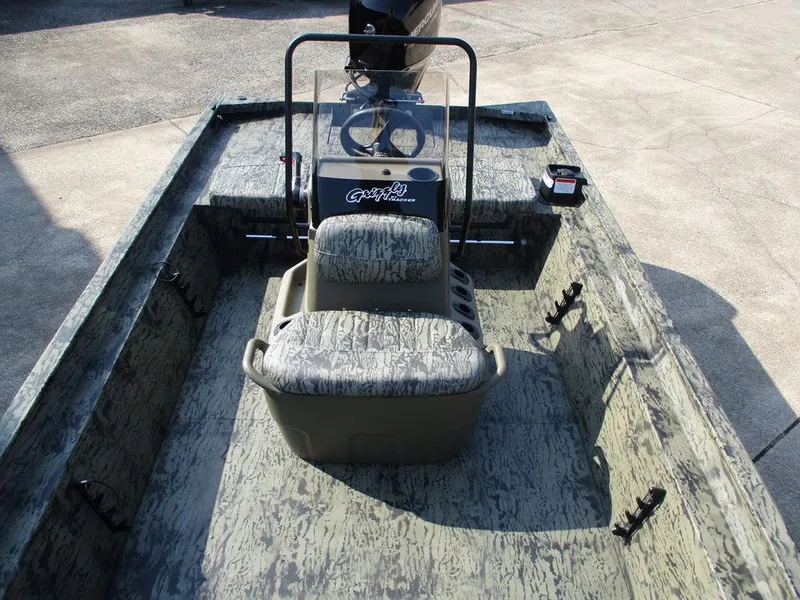 Slide: The Image of 2026 Tracker GRIZZLY® 1860 CC boat interior with camouflage seating and steering console. - 3