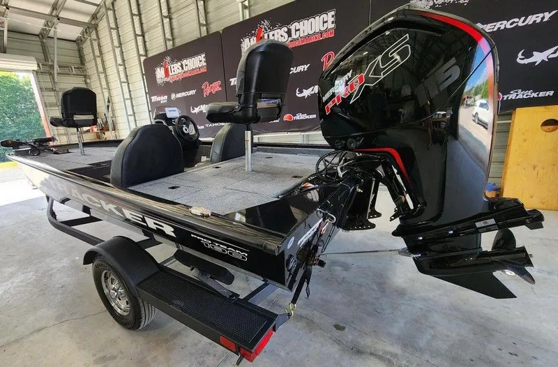 Slide: The Image of 2026 Tracker Pro Team™ 190 boat in a garage, featuring a powerful outboard motor. - 4