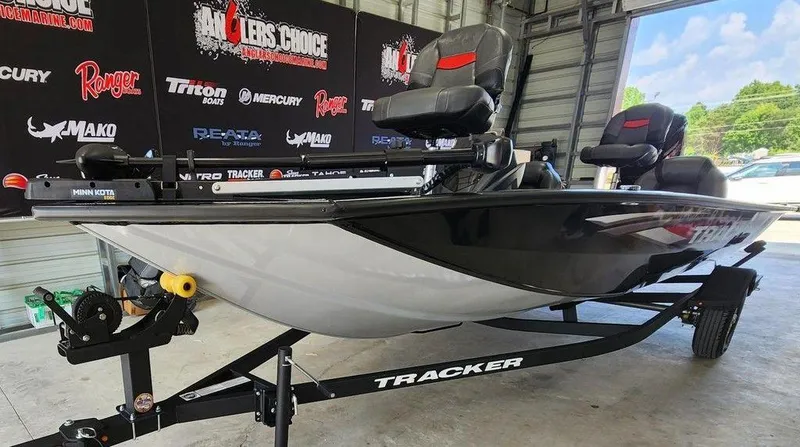 Slide: The Image of 2026 Tracker Pro Team™ 190 boat on trailer in showroom setting. - 5