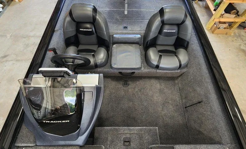 Slide: The Image of 2026 Tracker Pro Team™ 190 boat interior with dual seats and steering console. - 6