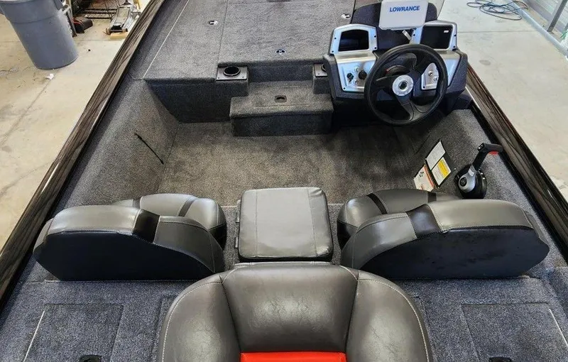 Slide: The Image of 2026 Tracker Pro Team™ 190 boat interior with steering wheel and seating. - 8