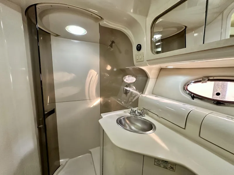 Slide: The Image of Bathroom interior of 1997 Regal Commodore 402 yacht, featuring sink and shower. - 10