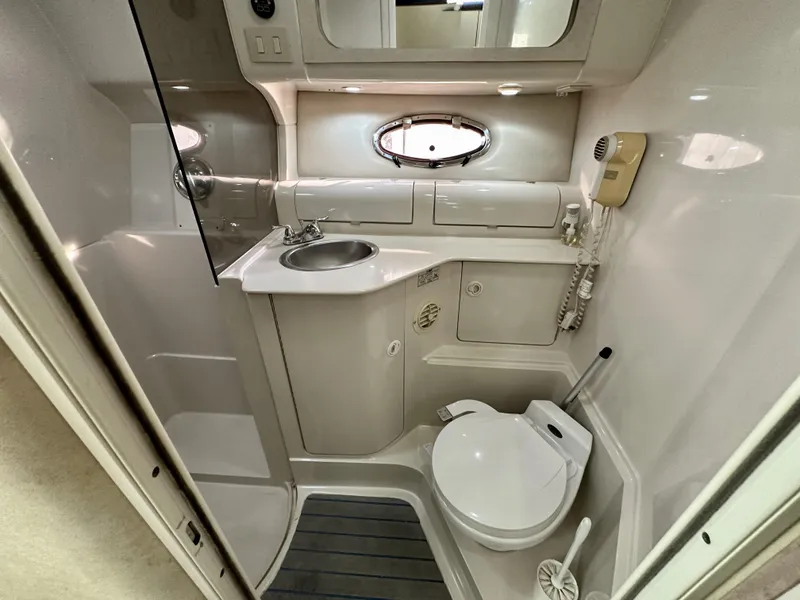 Slide: The Image of Bathroom interior of 1997 Regal Commodore 402 yacht, featuring sink and toilet. - 11