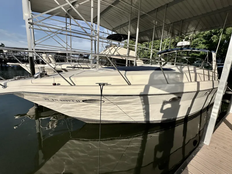 Slide: The Image of 1997 Regal Commodore 402 boat docked under a covered marina. - 5