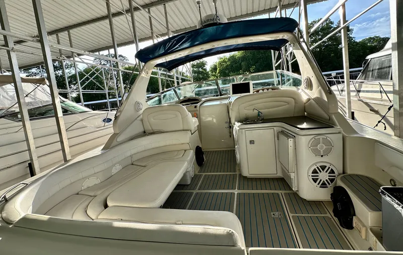Slide: The Image of 1997 Regal Commodore 402 boat interior with white seating and modern amenities. - 6