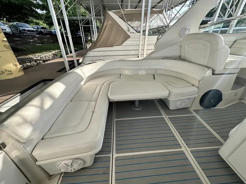 Slide: The Image of Luxurious seating area on a 1997 Regal Commodore 402 yacht, featuring white leather upholstery. - 8