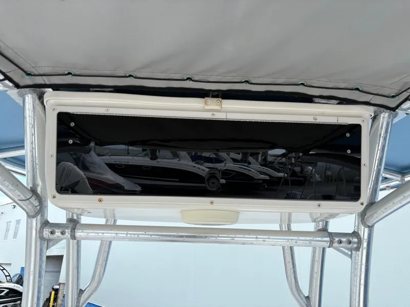 Slide: The Image of 2019 Carolina Skiff 198 DLV boat console with canopy and storage compartment. - 13