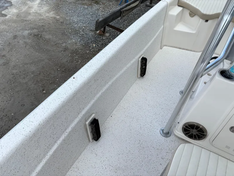 Slide: The Image of 2019 Carolina Skiff 198 DLV boat interior with white textured flooring and seating. - 14