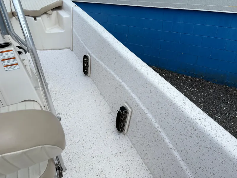 Slide: The Image of 2019 Carolina Skiff 198 DLV boat interior with white speckled deck and seating. - 15