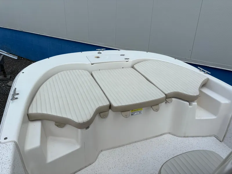 Slide: The Image of 2019 Carolina Skiff 198 DLV boat seating area with cushioned seats. - 17