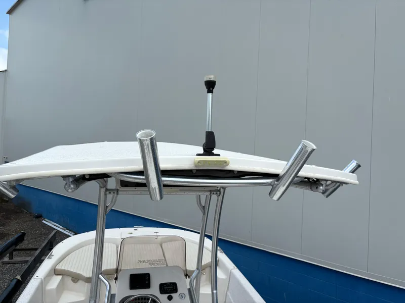 Slide: The Image of 2019 Carolina Skiff 198 DLV boat with T-top and rod holders. - 22