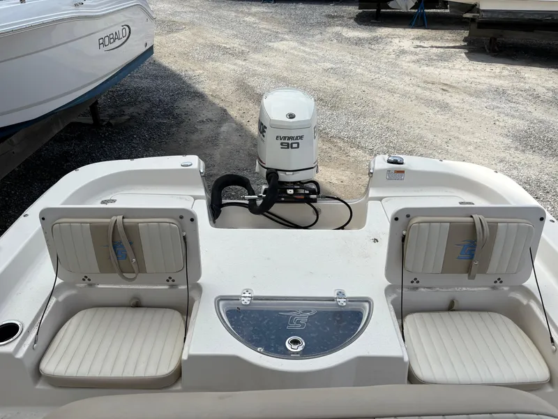 Slide: The Image of 2019 Carolina Skiff 198 DLV boat with Evinrude 90 engine, featuring rear seating. - 7