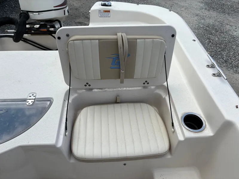 Slide: The Image of 2019 Carolina Skiff 198 DLV boat seat with cup holder and motor in view. - 9