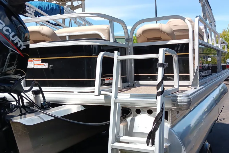 Slide: The Image of 2022 Sun Tracker Bass Buggy 18 DLX pontoon boat with Mercury engine and ladder. - 3