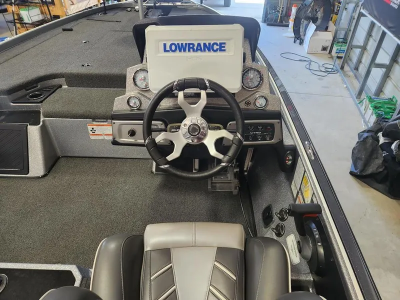 Slide: The Image of 2022 Nitro Z20 boat cockpit with steering wheel and Lowrance display. - 3