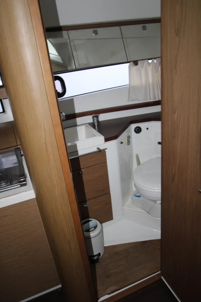 Slide: The Image of Cozy bedroom in 2012 Jeanneau Leader 10 yacht with elegant bedding. - 10