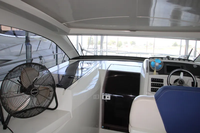 Slide: The Image of Interior view of 2012 Jeanneau Leader 10 yacht cockpit with fans and steering wheel. - 20