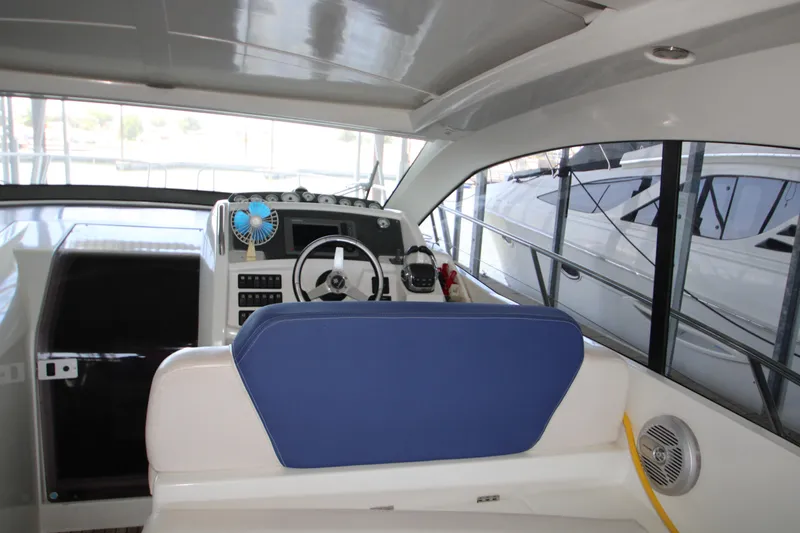 Slide: The Image of Interior view of 2012 Jeanneau Leader 10 boat cockpit with steering wheel and controls. - 21