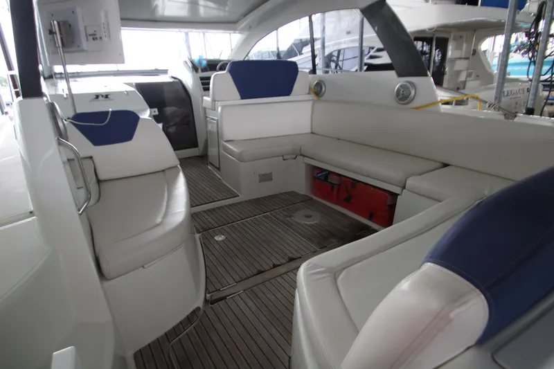 Slide: The Image of Interior of 2012 Jeanneau Leader 10 yacht with white seating and wooden flooring. - 27