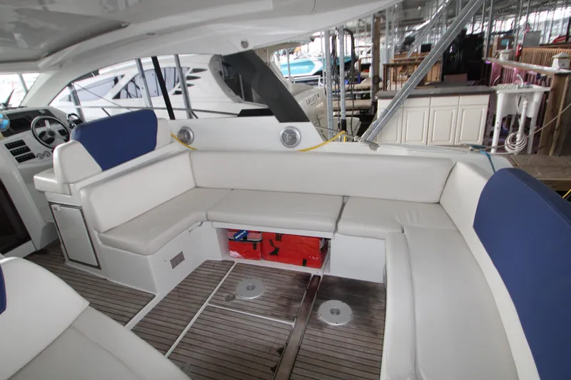 Slide: The Image of Interior of 2012 Jeanneau Leader 10 yacht with white seating and wooden flooring. - 28