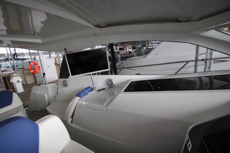 Slide: The Image of Interior of 2012 Jeanneau Leader 10 yacht with seating and mounted TV. - 29