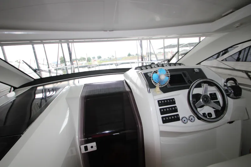 Slide: The Image of 2012 Jeanneau Leader 10 yacht cockpit with steering wheel and control panel. - 30