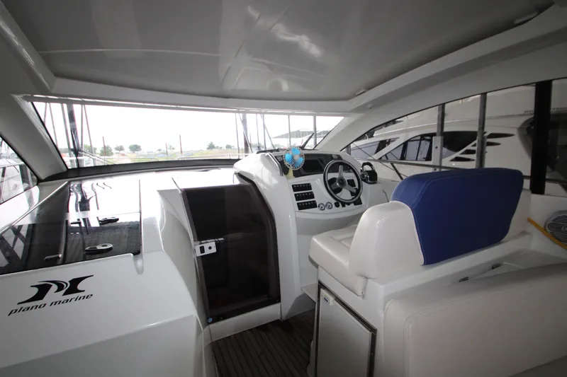 Slide: The Image of Interior view of 2012 Jeanneau Leader 10 yacht cockpit with steering wheel and seating. - 32