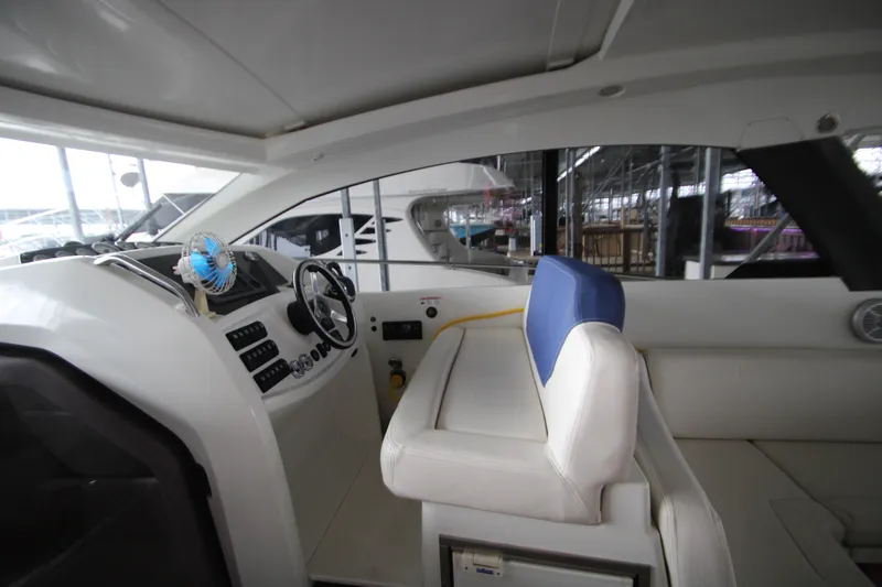 Slide: The Image of Interior of 2012 Jeanneau Leader 10 yacht with steering wheel and seating area. - 33