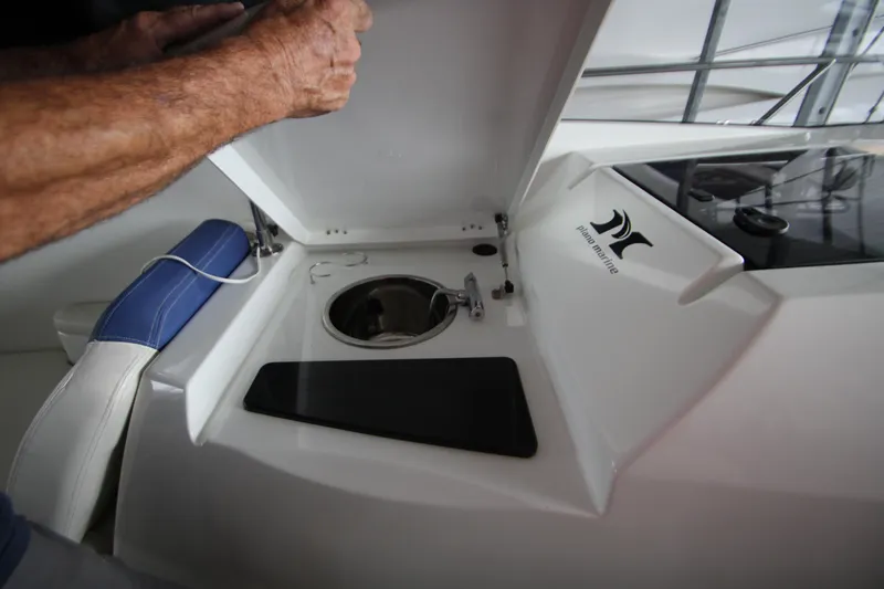 Slide: The Image of 2012 Jeanneau Leader 10 boat interior with open storage compartment. - 41