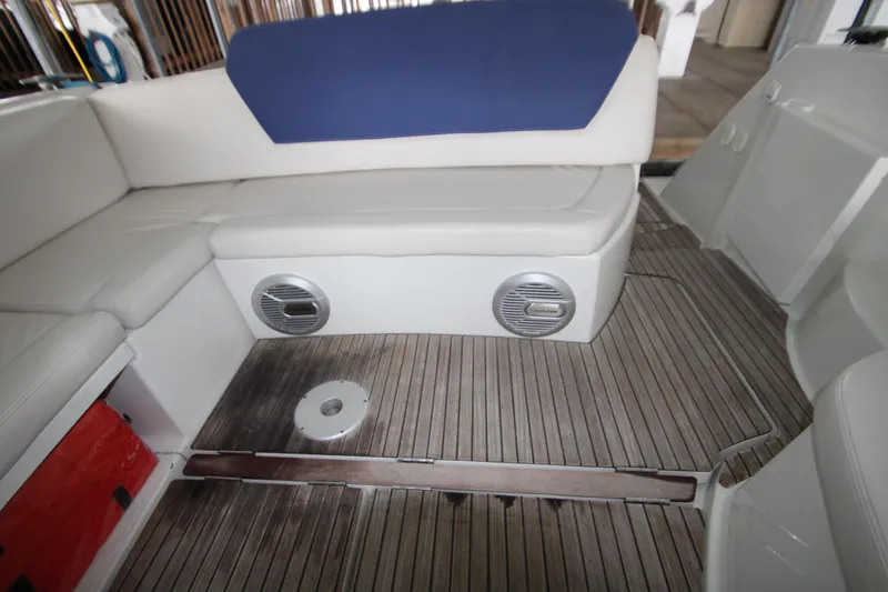 Slide: The Image of Interior of 2012 Jeanneau Leader 10 boat with cushioned seating and wooden flooring. - 42