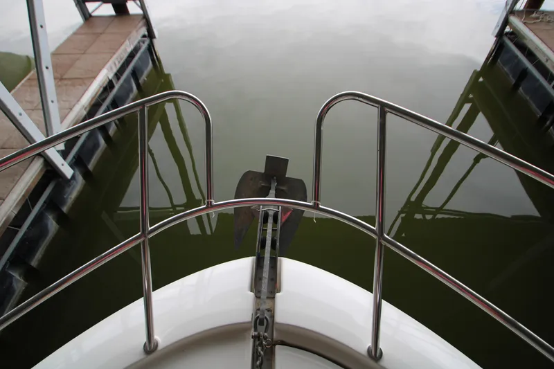 Slide: The Image of Bow view of 2012 Jeanneau Leader 10 boat with anchor and railing. - 45
