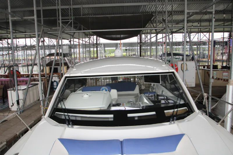 Slide: The Image of 2012 Jeanneau Leader 10 yacht docked in a covered marina. - 48