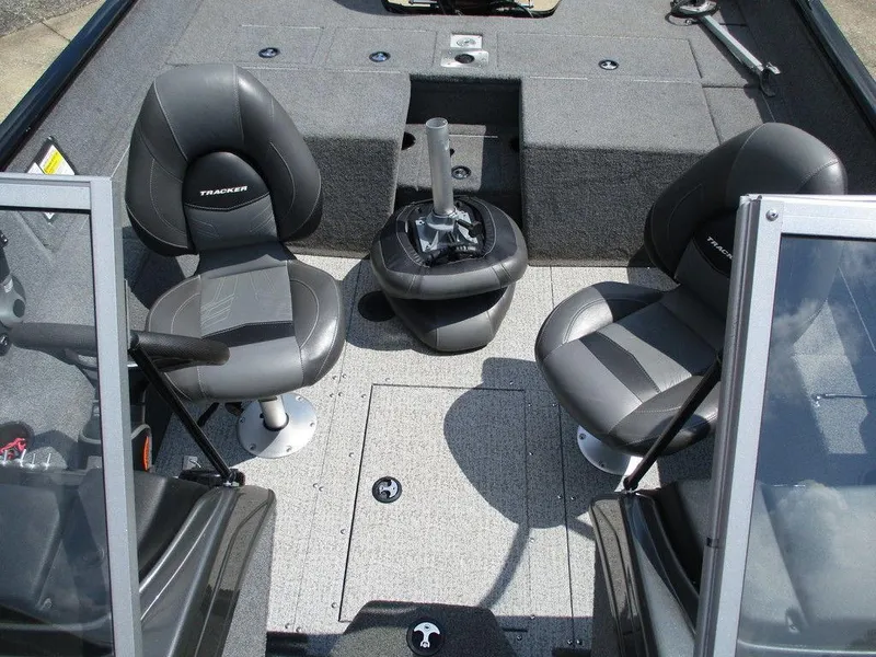 Slide: The Image of 2020 Tracker Pro Guide V-175 Combo boat interior with two seats and carpeted flooring. - 3