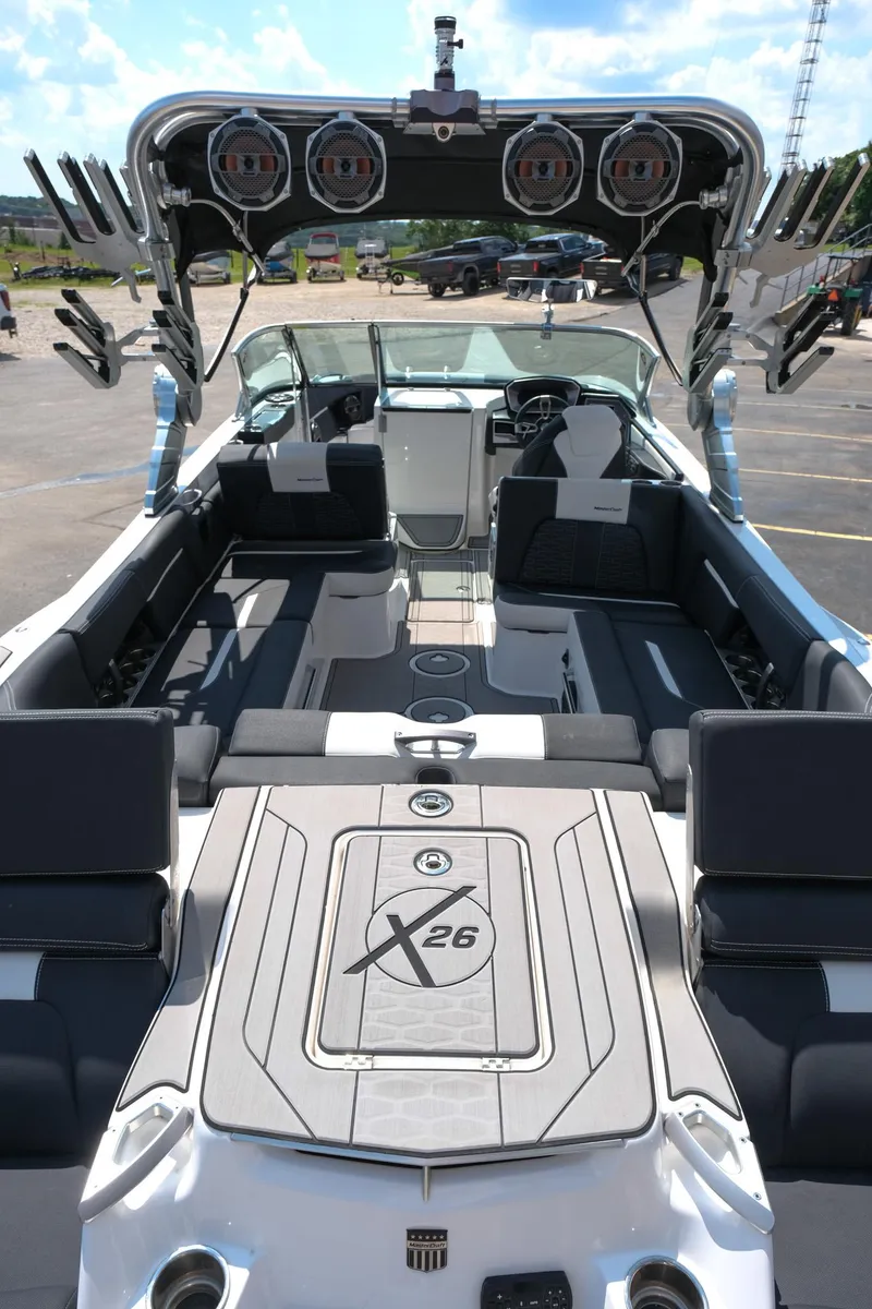 Slide: The Image of 2021 MasterCraft X26 boat interior with seating and speakers, showcasing luxury and design. - 10