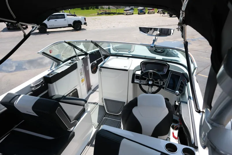 Slide: The Image of Interior of 2021 MasterCraft X26 boat with modern dashboard and seating. - 12