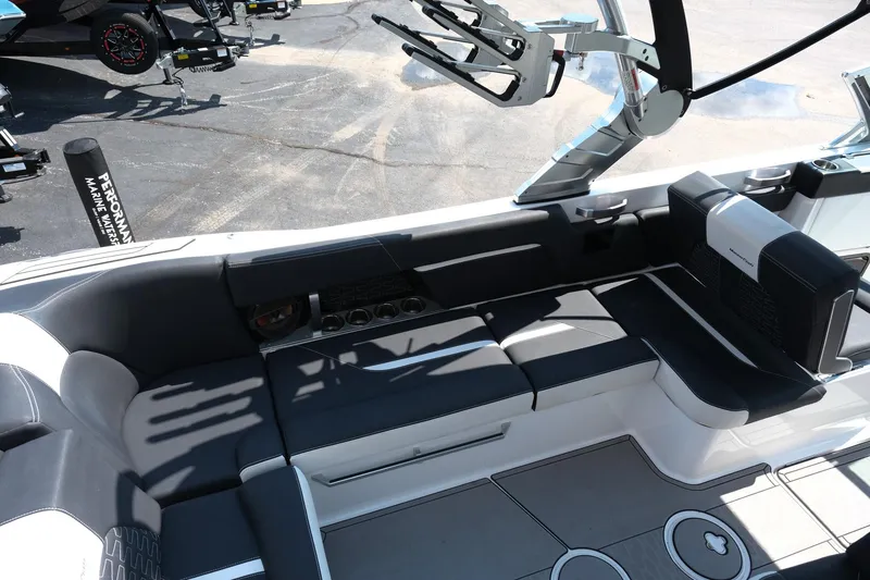 Slide: The Image of 2021 MasterCraft X26 boat interior with sleek seating and modern design. - 13
