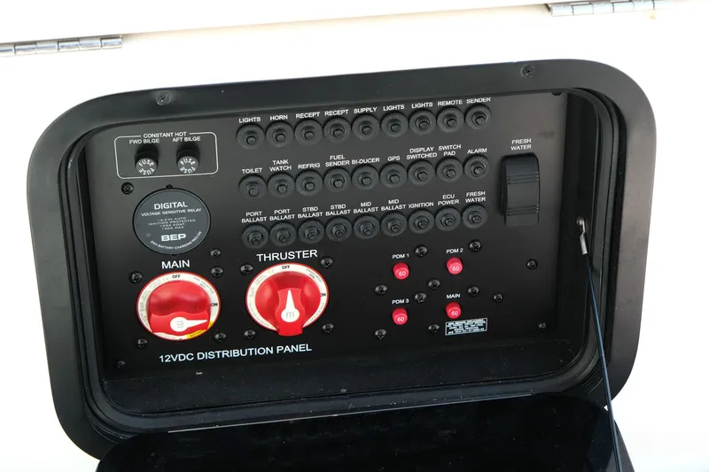 Slide: The Image of Control panel of a 2021 MasterCraft X26 boat, featuring various switches and dials. - 16