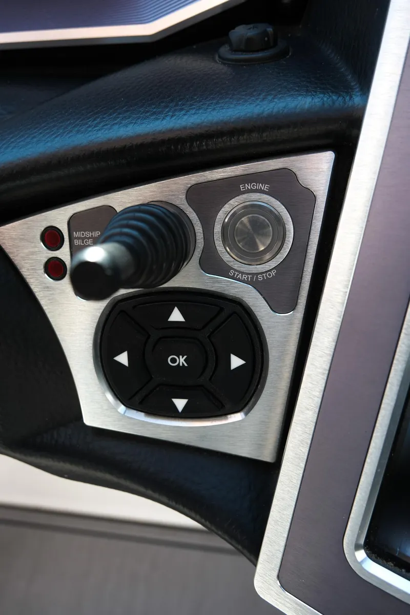 Slide: The Image of Control panel of 2021 MasterCraft X26 boat with engine start/stop button and joystick. - 22