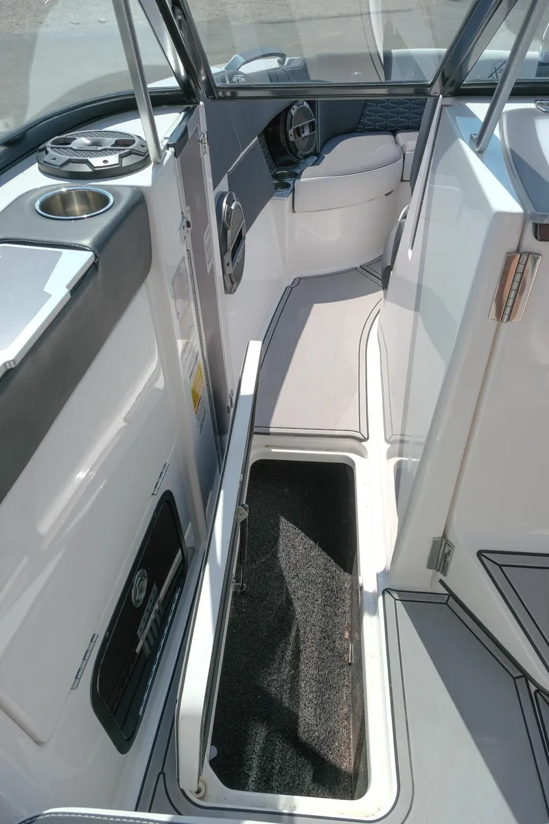 Slide: The Image of Interior of 2021 MasterCraft X26 boat, featuring sleek design and storage compartment. - 23