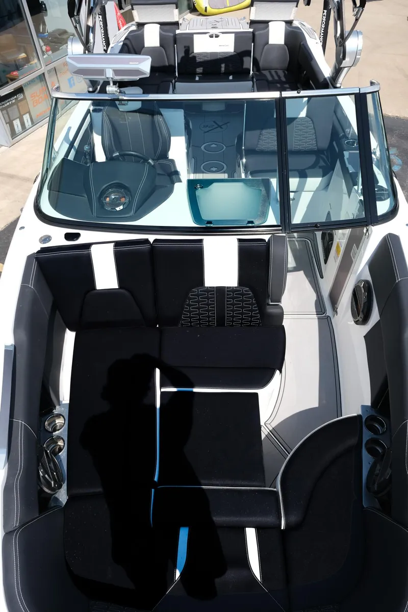 Slide: The Image of 2021 MasterCraft X26 boat interior with black and white seating and modern design. - 31
