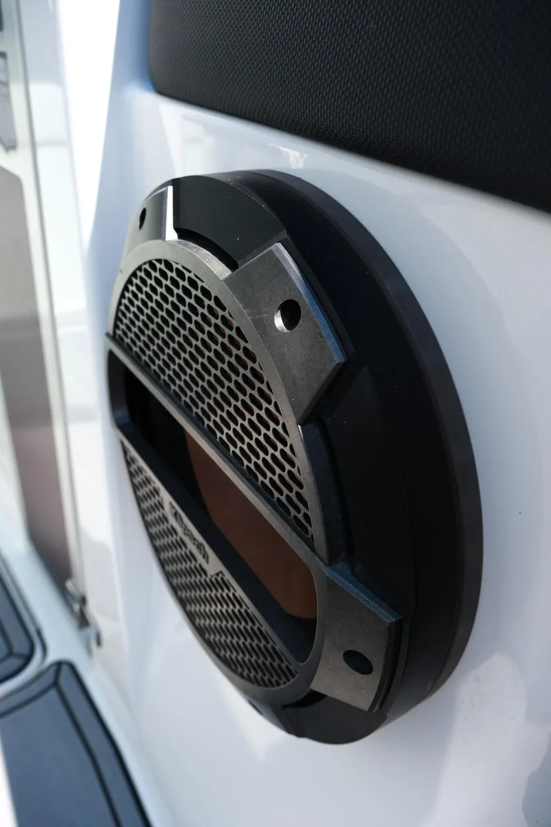 Slide: The Image of Close-up of a 2021 MasterCraft X26 boat speaker with black grille. - 33