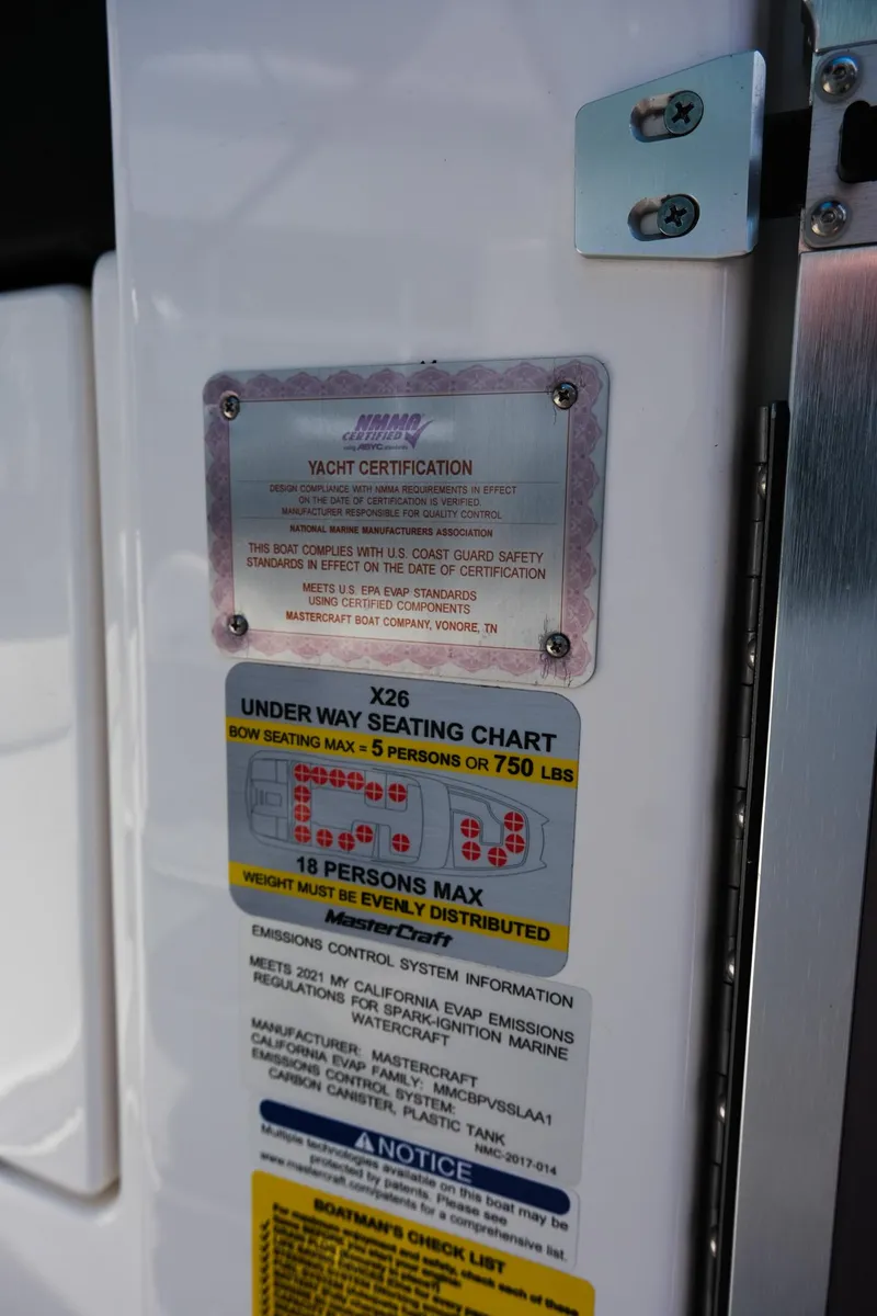 Slide: The Image of 2021 MasterCraft X26 yacht certification and seating chart details. - 34