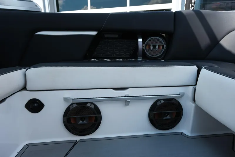 Slide: The Image of 2021 MasterCraft X26 boat interior with premium speakers and seating. - 35