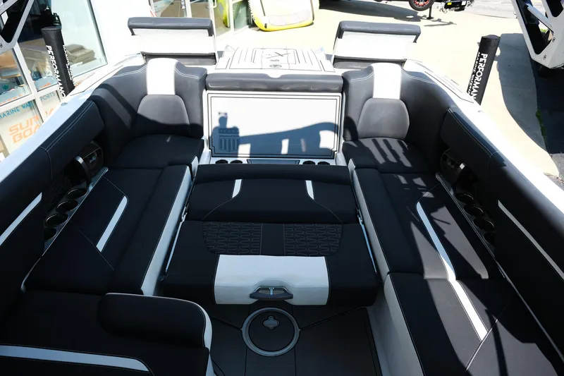 Slide: The Image of 2021 MasterCraft X26 boat interior with luxurious black and white seating. - 36