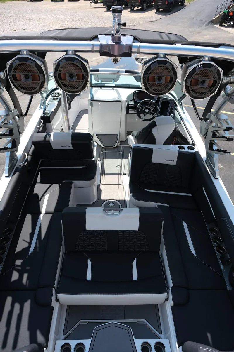 Slide: The Image of 2021 MasterCraft X26 boat interior with luxury seating and advanced audio system. - 37