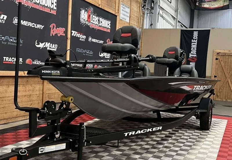 Slide: The Image of 2026 Tracker Pro Team™ 195 Tournament Edition boat displayed indoors on a trailer. - 3