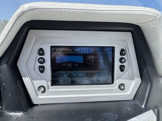 Slide: The Image of 2019 Tigé R21 boat dashboard with touchscreen display and control buttons. - 23