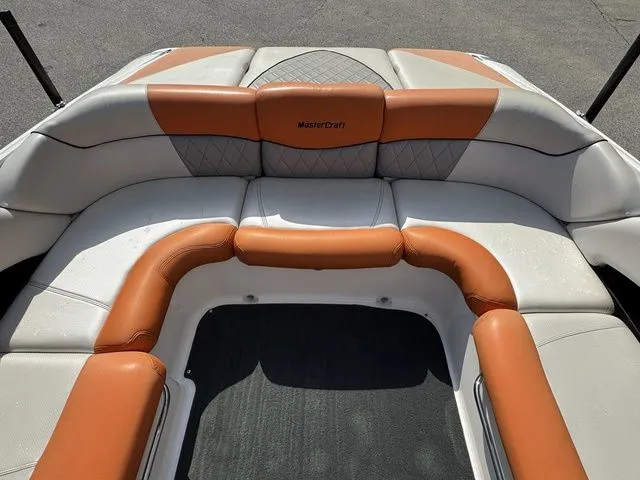 Slide: The Image of 2012 MasterCraft X-35 boat interior with orange and white seating. - 25
